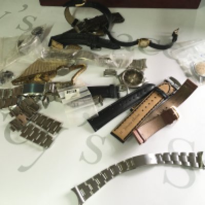 A collection of assorted watch straps and other spares including a watch box and possibly a vintage rolex watch strap