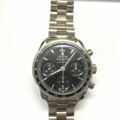 An omega speedmaster with black dial. 38mm case with box cards and instruction book. Comes with original receipt. In excellent condition seen running.