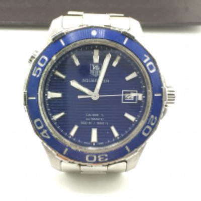 A gents Tag Heuer Aquaracer watch. With box and paperwok. Seen running. 45mm including crown.