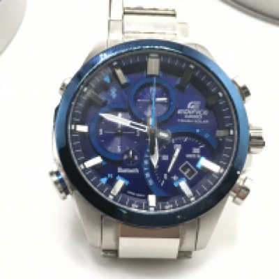 A gents Edifice casino watch in tin. Seen running. Approximately 50 mm including crown. Postage B