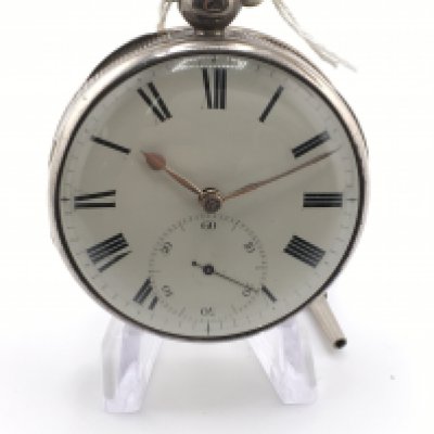 A silver cased EK&Co silver key wind pocket watch. Runs intermittently. Approximately 50mm case.