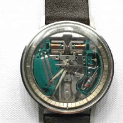 A Bulova watch with visible movement. Seen working. Black leather strap. 36mm case.