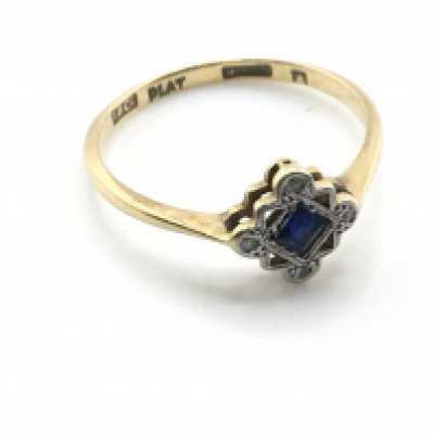 An 18ct gold and platinum sapphire set ring. 1.9g and size O Postage A