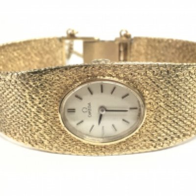 A ladies 9 carat gold Omega watch, 34.65g. Postage category a