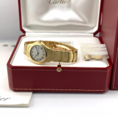 A gents 18ct gold Cartier Cougar LM yellow gold quartz wrist watch, Ltd run of 500 pieces, serial number 11651C44259. Complete with additional links, box and papers, Seen working. Total weight including links 138.81g.