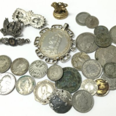 A collection of british and world coins including an 1887 mounted crown and pins including a silver hallmarked example. Postage category a