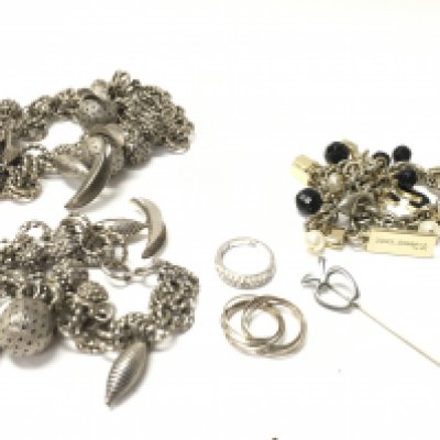 A white metal bracelet and necklace, a silver ring and a Dolce Gabbana bracelet