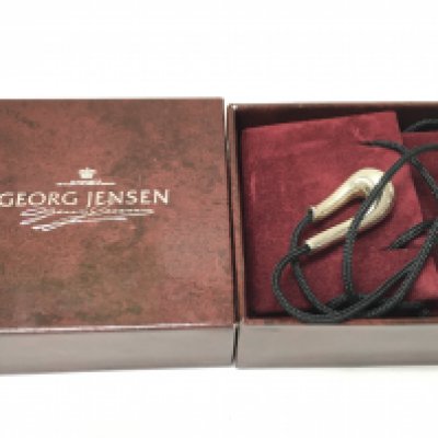 A Georg Jensen boxed silver hallmarked necklace. Postage category a