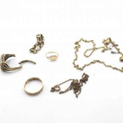 A collection of 9ct gold items including rings and chains. 12.3g Postage A