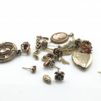 A collection of earrings and chains including a small cameo. 18.9g