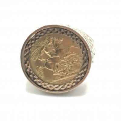 A 1909 full sovereign set in a 9ct gold ring. Size V and 12.7g Postage B.
