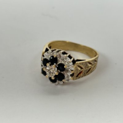 A 9ct gold diamond and sapphire cluster ring