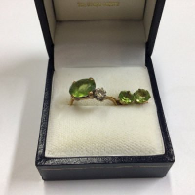 A 9ct gold set of tourmaline set earring and a ring.