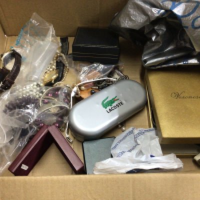 A box of costume jewellery and watches.