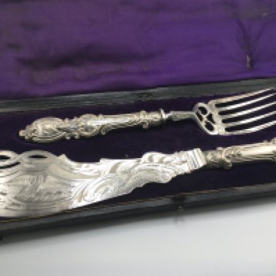 A cased fish set. Postage B