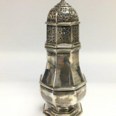 A large silver sugar caster, Sheffield hallmarks, approx height 20cm. Shipping category B.