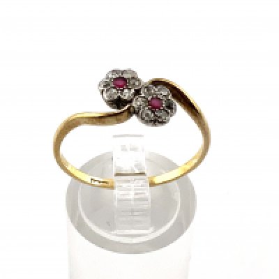 A 1930s 18ct Daisy ruby and diamond ring. (A)