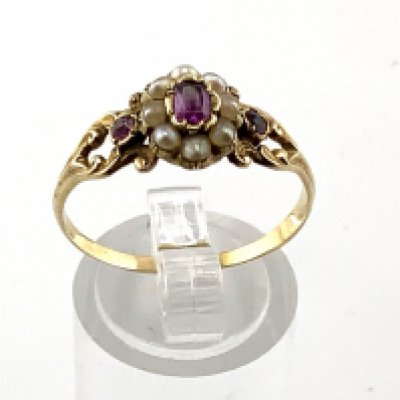 An antique unmarked high carat ruby and seed pearl ring (A)