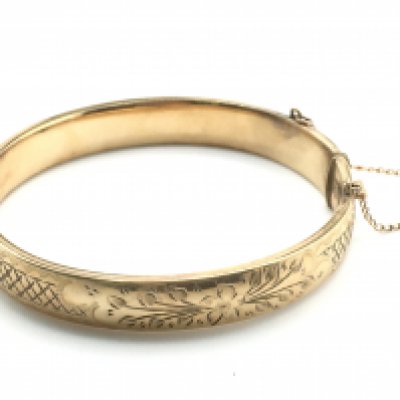 A 1/5 gold bangle. Postage category A