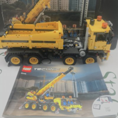 A Lego Mobile Crane Made Into A Truck. #42108 With Box And Manual this Lot Cannot Be Posted In House.
