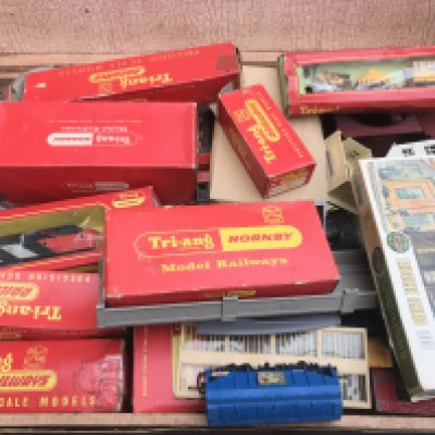 A Case Containing A Collection Of Hornby/Tri-Ang 00 Gauge Locos. Wagons. Buildings etc.(2)