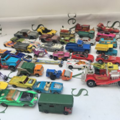 A Box Containing Playworn Diecast. Including A Batmobile With Batboat And Trailer.