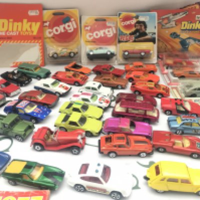 A Collection of Playworn and Carded Diecast Including Catalogs.