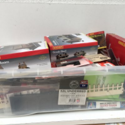 A box containing a large selection of model railway accessories mostly new and unused. Includes buildings..scenery..vehicles etc. multiple manufacturers including Hornby..Metcalfe..Ratio plus others. No reserve