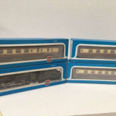 Boxed OO gauge model railway pieces by Airfix featuring a locomotive and tender Royal Scot and 3x coaches. No reserve