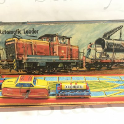 A Boxed German Tinplate Car Elevator And A Automatic Loader.Boxes Are Worn.