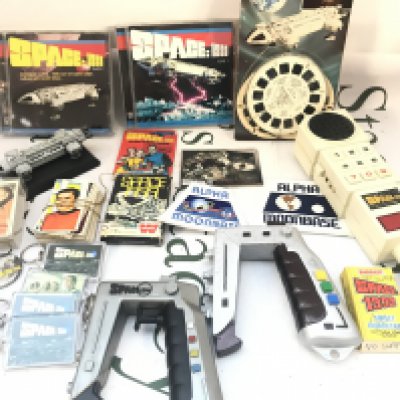 A Small Collection Of Space 1999 Toys Key Rings etc. including A Sealed Packet Of Bubble Gum Cards. No Reserve.