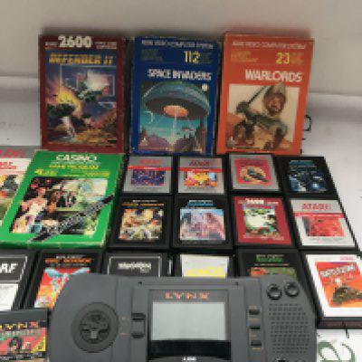 A Collection of Atari Games And An Atari Lynx With One Game. Also A Collection of Atari Books etc.No Reserve.