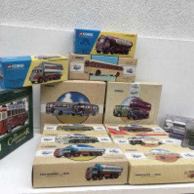 A collection of 15 boxed Corgi model diecast vehicles mostly buses or coaches plus 3 tankers. No reserve