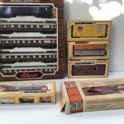 A collection of boxed HO gauge model railway items including a locomotive by Bachmann plus Part loco by ConCor. Also includes 3x Box cars by Bachmann plus a set of 5 carriages by Lilliput. No reserve.
