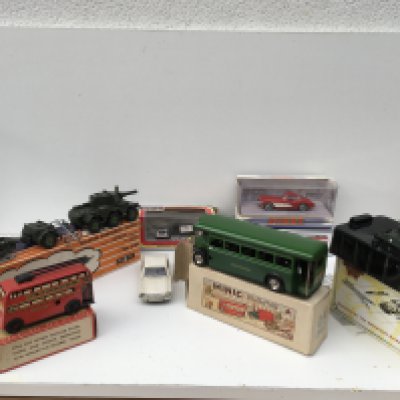 A mixed collection of 8 diecast and tinplate model vehicles 7 in their original packaging. Manufacturers include Arat ..Dinky..Crescent..Matchbox..Triang minic..Wells etc.