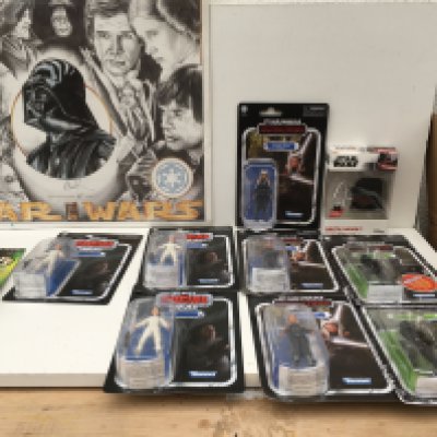 A group of 11 Star Wars pieces featuring a signed Artist Poof print from a limited edition of 1000 with Certificate of Authenticity . 9 x carded figures featuring the Empire Strikes Back..the Mandalorian and the Power of the Force. Also boxed Darth Vader AirPods Case.