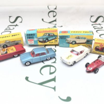 A Boxed Corgi Ford Thunderbird-Open Sports #2155 a Rover 2000 #252. The Saints Car #258 And A Dinky Ferrari Racing Car #242 parts Missing #242. Boxes Are Worn.