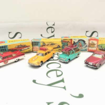 4 Boxed Corgi Vehicles. A Chevrolet Fire Chief #482. A Citroen Safari (playworn) #436. A B.M.C Mini Countryman #485 And A Jaguar Mark x (Play Worn) #238. Boxes Are Worn.