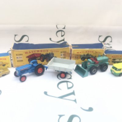 A Collection Of 4 Matchbox Vehicles. A Opel Diplomat #36 A Fordson Tractor and Trailer K-11. A Tractor Shovel #K-10 And A BP Petrol Tanker #M-1. Boxes Are Worn.