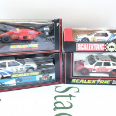 4 X Boxed Scalextric Cars. A Ferrari F1 #C.457. A Ford Escort Cosworth #C.203. A Taurus Rover 3500 #C.384 And A Spanish Ford R.S. 200 #4088.