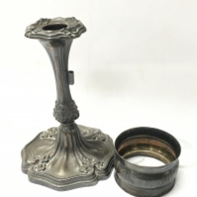 A silver chamber stick and a napkin ring. Postage category a