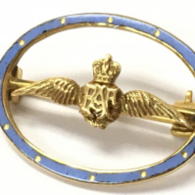 A 9ct gold and enamel RAF pin, approximately 3g. Postage category A