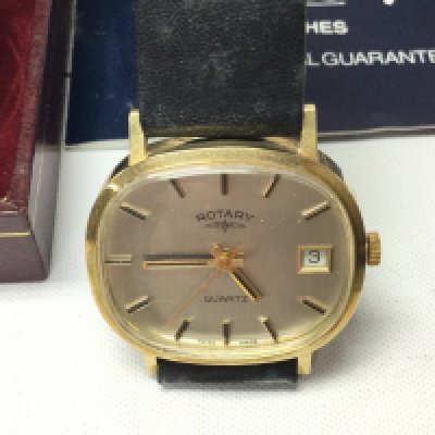 A 1980s 9ct gold gents Rotary wrist watch on black leather strap. Not seen working comes with box and papers. 27g total weight. Postage B