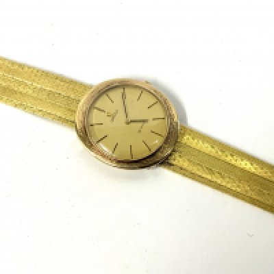An 18ct gold omega De Ville watch. 57.73g Postage B