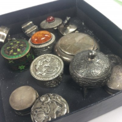 A collection of silver pill boxes , postage category A
