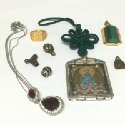 A small bag of Tibetan and Oriental jewellery. Shipping category A.. NO RESERVE