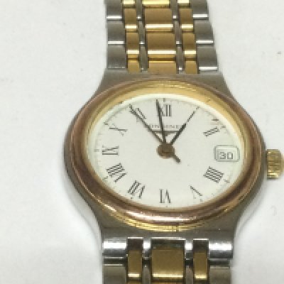 A ladies Longines Flagship watch with extra links. Shipping category A.
