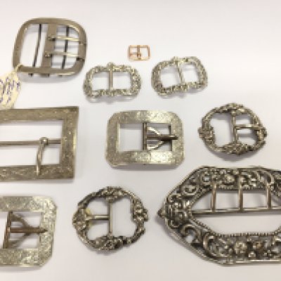 A collection of silver hallmarked buckles including some late 19th century buckles and a 9ct gold example . Postage category A