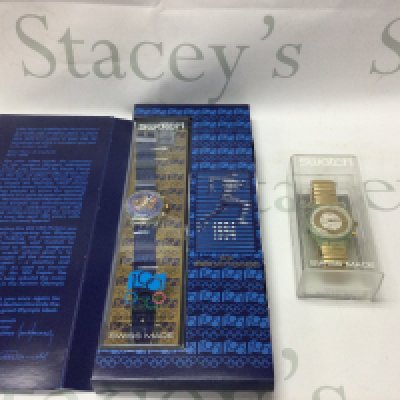 Two swatch watches including one hundred years of the olympics and one other. Postage B NO RESERVE