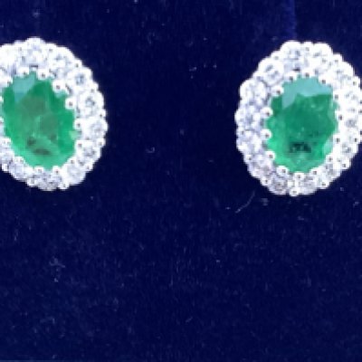 18ct white gold oval emerald and RBC diamond cluster ear studs, boxed. Emeralds 1.42ct, diamonds 0.64ct. Postage category A.
